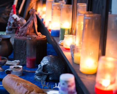 Candles lit on an altar for ritual at the Green Man Store
