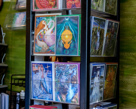 A display rack of greeting cards with pagan illustrations