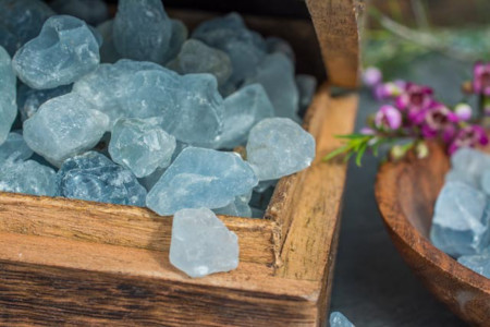 Raw blue crystals in a wooden box