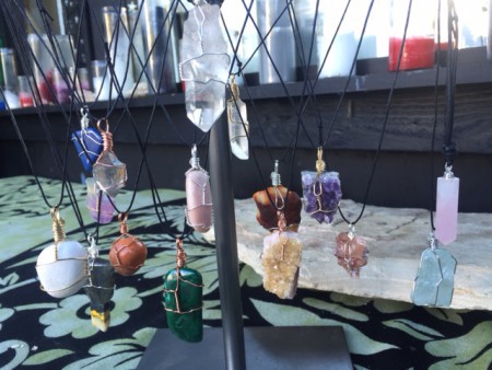 Crystal necklaces hang on a display