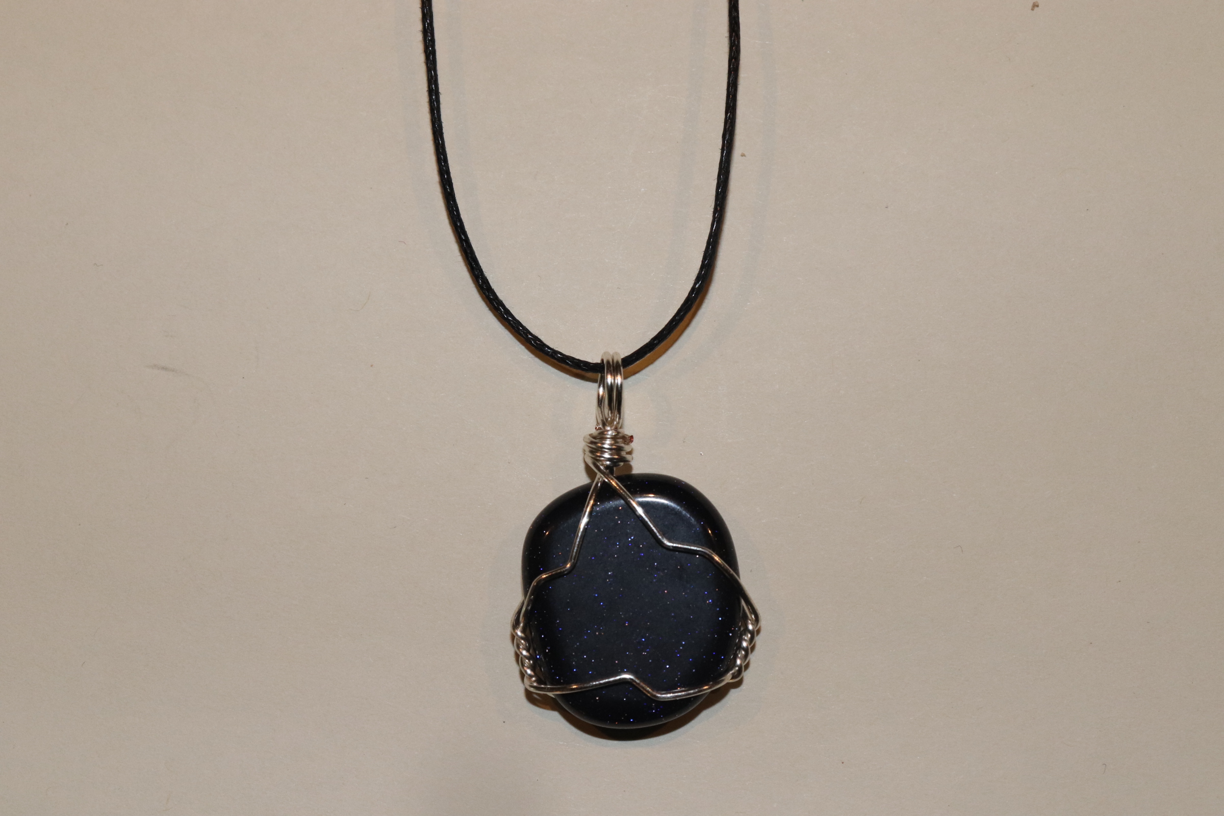 Blue goldstone wire wrapped pendant
