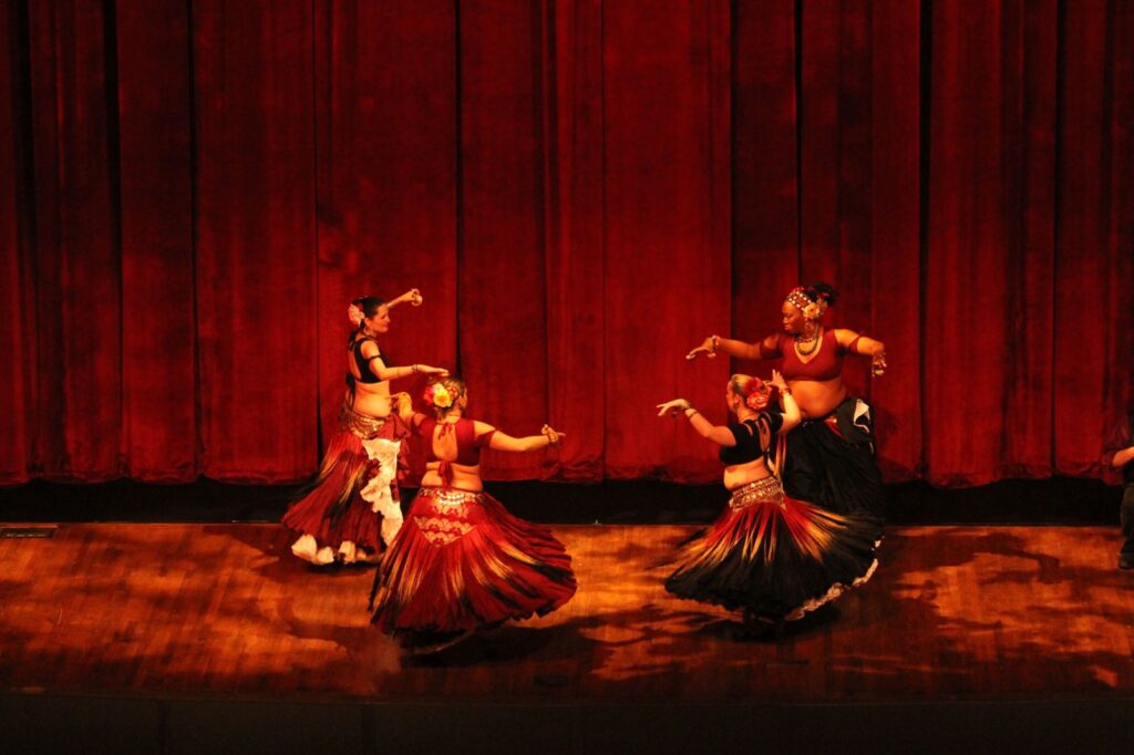 a group of women dancing on a stage