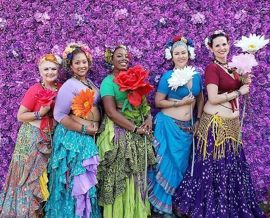 a group of women posing for a photo