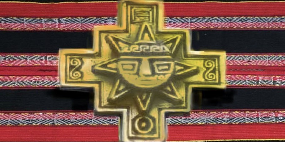 a gold cross with a face on it