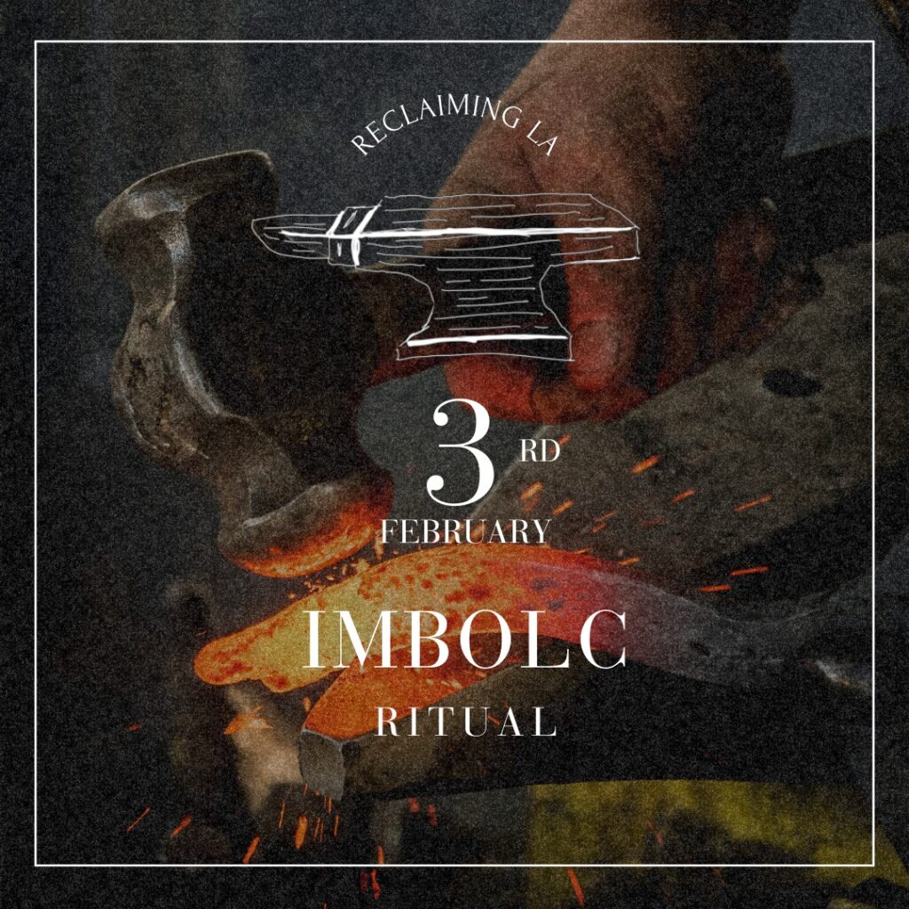 a person's hand holding a hammer over hot coals